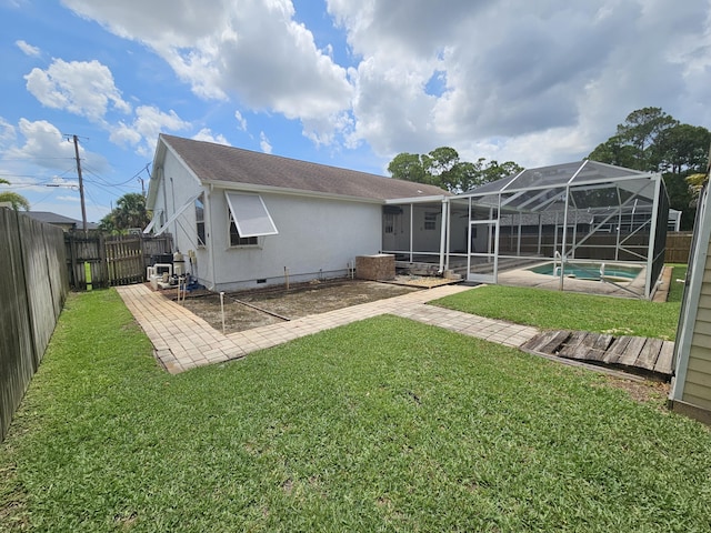 3817 SW Cheribon St, Port Saint Lucie, FL 34953 - back of house with crawl space, a patio, stucco siding, and glass enclosure