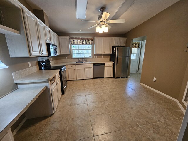 3817 SW Cheribon St, Port Saint Lucie, FL 34953 - kitchen featuring appliances with stainless steel finishes, a sink, light countertops, and a ceiling fan