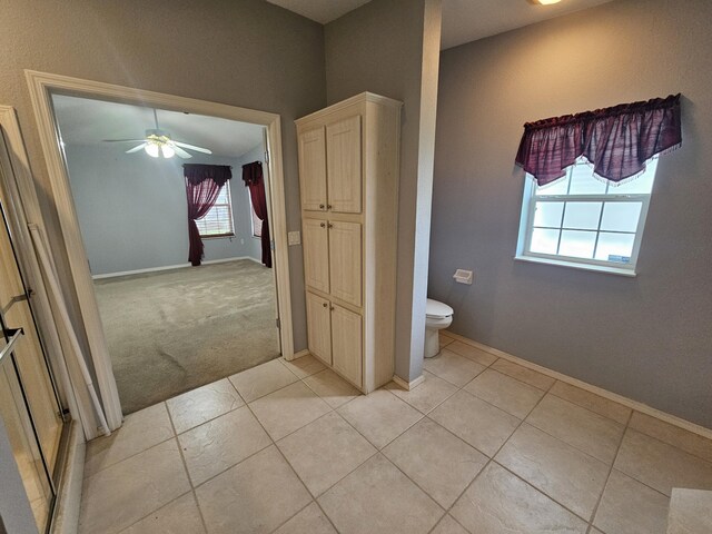 3817 SW Cheribon St, Port Saint Lucie, FL 34953 - full bathroom featuring toilet, ceiling fan, tile patterned floors, and baseboards