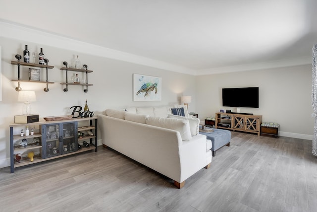 3900 County Line Rd Unit 4C, Tequesta, FL 33469 - living room with wood finished floors, crown molding, and baseboards