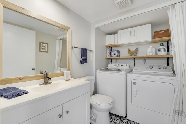 3900 County Line Rd Unit 4C, Tequesta, FL 33469 - bathroom with washing machine and dryer, toilet, and vanity