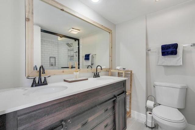 3900 County Line Rd Unit 4C, Tequesta, FL 33469 - full bathroom featuring double vanity, toilet, a stall shower, baseboards, and tile patterned floors