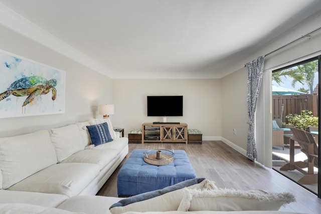 3900 County Line Rd Unit 4C, Tequesta, FL 33469 - living room featuring wood finished floors, baseboards, and crown molding