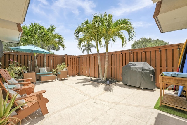 3900 County Line Rd Unit 4C, Tequesta, FL 33469 - fenced backyard with a patio and area for grilling
