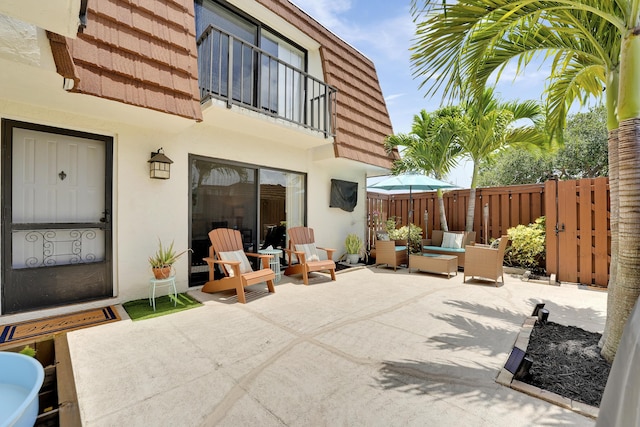 3900 County Line Rd Unit 4C, Tequesta, FL 33469 - view of patio / terrace with a balcony and an outdoor living space