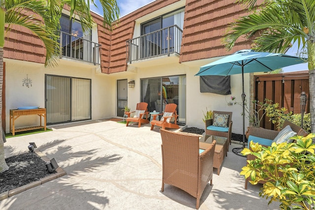 3900 County Line Rd Unit 4C, Tequesta, FL 33469 - view of patio with a balcony and outdoor lounge area
