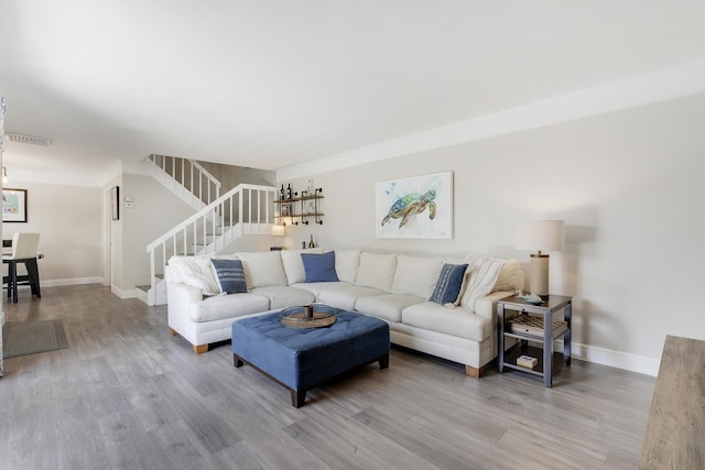 3900 County Line Rd Unit 4C, Tequesta, FL 33469 - living area featuring stairway, wood finished floors, and baseboards