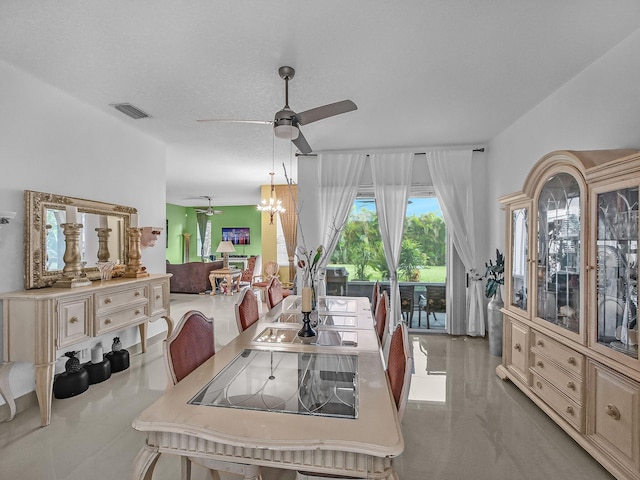 1081 SW Jacqueline Ave, Port Saint Lucie, FL 34953 - dining area with a ceiling fan, tile patterned flooring, and a chandelier