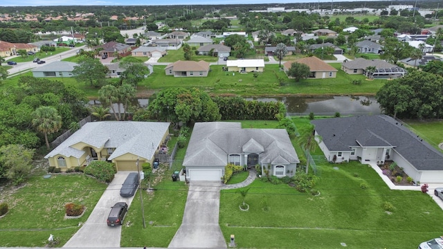 1081 SW Jacqueline Ave, Port Saint Lucie, FL 34953 - aerial view of property and surrounding area featuring nearby suburban area and a large body of water