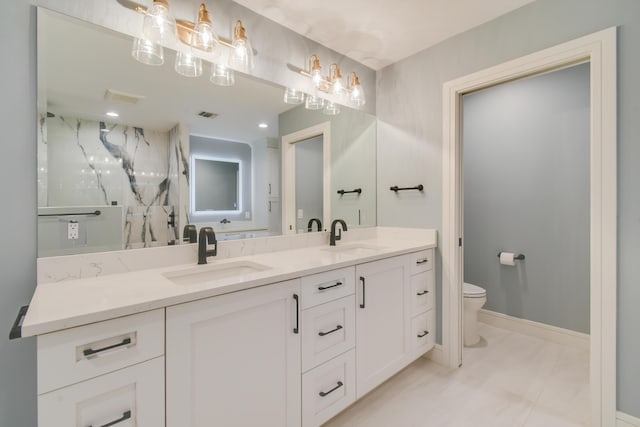 438 River Edge Rd, Jupiter, FL 33477 - bathroom with double vanity, toilet, a marble finish shower, baseboards, and marble finish floors