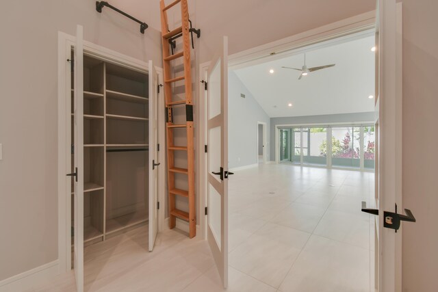438 River Edge Rd, Jupiter, FL 33477 - corridor with high vaulted ceiling, light tile patterned flooring, baseboards, and french doors