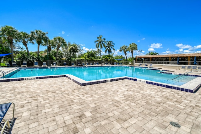 438 River Edge Rd, Jupiter, FL 33477 - community pool with a patio area