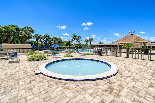 438 River Edge Rd, Jupiter, FL 33477 - community pool with a patio area and a gazebo