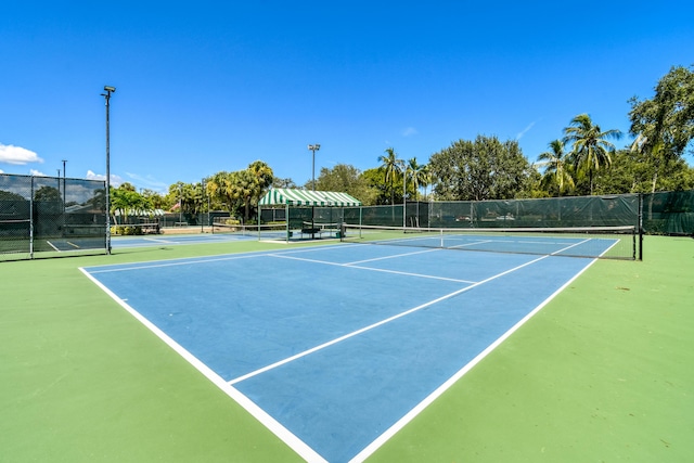 438 River Edge Rd, Jupiter, FL 33477 - view of tennis court with community basketball court