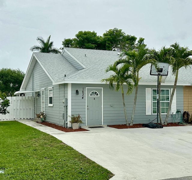 1634 Royal Forest Ct, West Palm Beach, FL 33406 - view of front facade with a shingled roof
