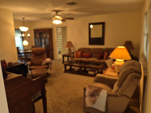 2897 SW Ortega St, Port Saint Lucie, FL 34953 - living area with carpet floors and a ceiling fan