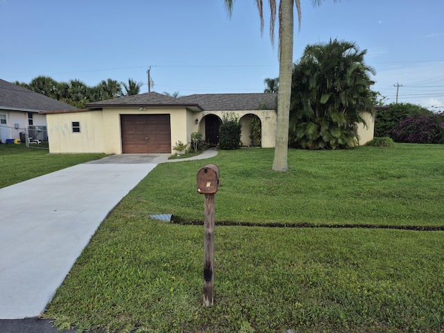 2897 SW Ortega St, Port Saint Lucie, FL 34953 - ranch-style home with concrete driveway, stucco siding, a garage, and a front yard
