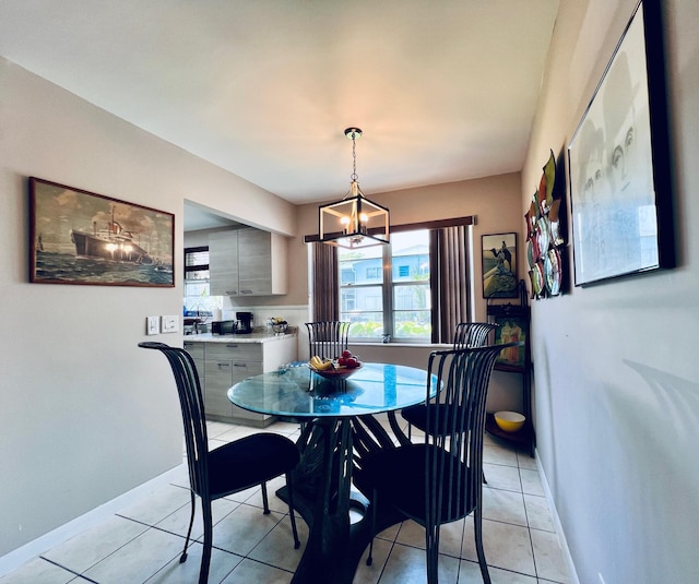 104 Cambridge E, West Palm Beach, FL 33417 - dining room with baseboards, light tile patterned floors, and a chandelier
