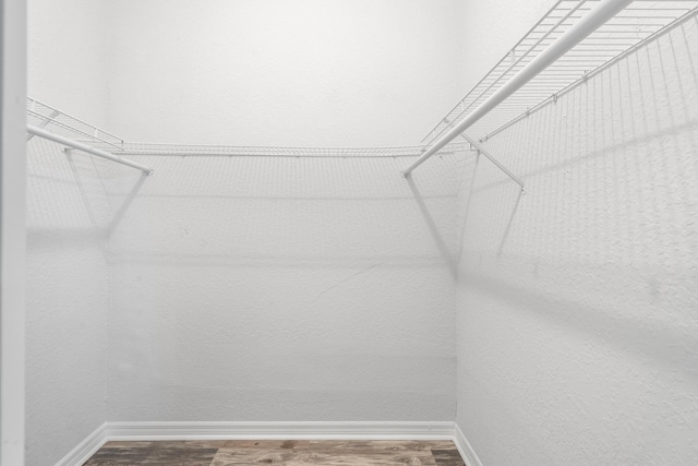 5554 Boynton Gardens Dr, Boynton Beach, FL 33437 - spacious closet featuring wood finished floors