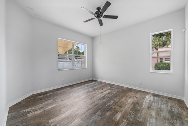 5554 Boynton Gardens Dr, Boynton Beach, FL 33437 - spare room with wood finished floors, a ceiling fan, and baseboards