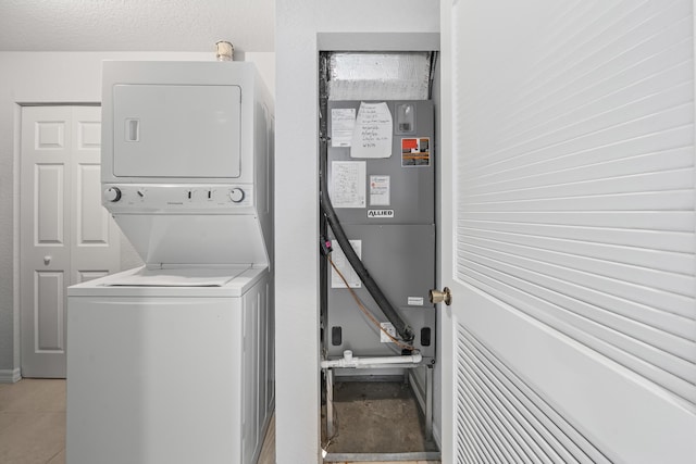 5554 Boynton Gardens Dr, Boynton Beach, FL 33437 - laundry room with stacked washing machine and dryer
