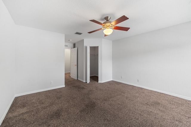 5554 Boynton Gardens Dr, Boynton Beach, FL 33437 - unfurnished bedroom with dark carpet, baseboards, a closet, and ceiling fan