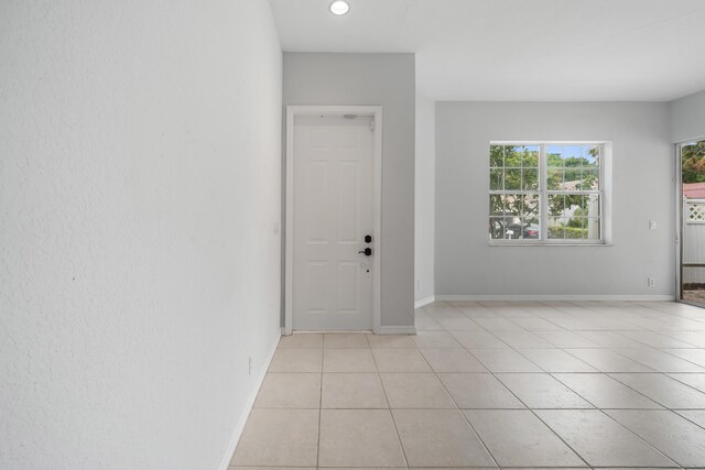 5554 Boynton Gardens Dr, Boynton Beach, FL 33437 - foyer featuring light tile patterned floors, baseboards, and recessed lighting