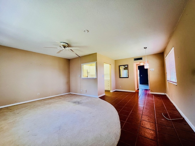 80 Norwich D, West Palm Beach, FL 33417 - unfurnished room featuring ceiling fan and dark tile patterned floors