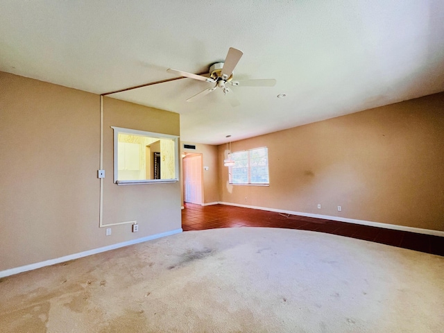 80 Norwich D, West Palm Beach, FL 33417 - spare room with dark colored carpet and a ceiling fan
