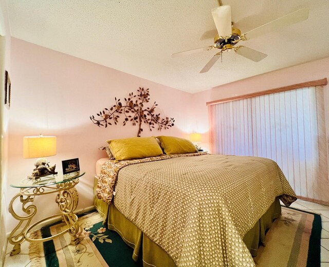226 Wellington Unit G, West Palm Beach, FL 33417 - bedroom featuring ceiling fan and tile patterned floors