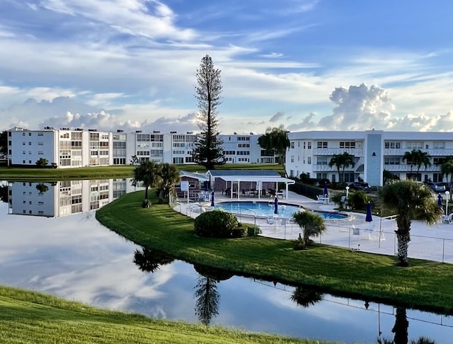 226 Wellington Unit G, West Palm Beach, FL 33417 - view of community featuring a swimming pool, a water view, and a patio area