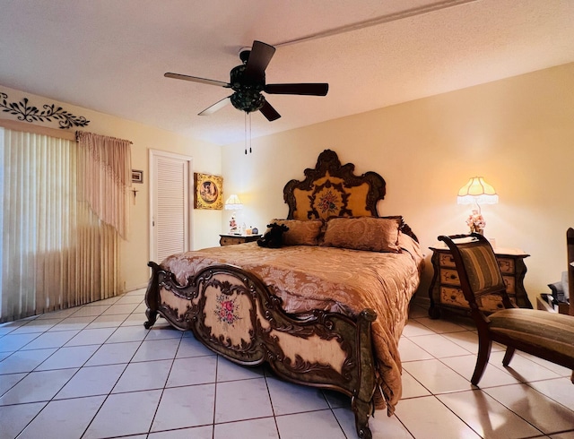 226 Wellington Unit G, West Palm Beach, FL 33417 - bedroom featuring light tile patterned flooring, a closet, and ceiling fan