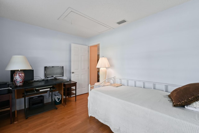 6506 Kings Hwy, Fort Pierce, FL 34951 - bedroom featuring attic access and wood finished floors