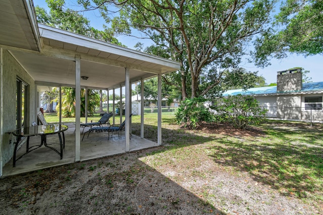 6506 Kings Hwy, Fort Pierce, FL 34951 - view of green lawn with a patio