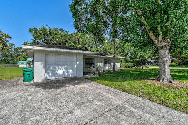 6506 Kings Hwy, Fort Pierce, FL 34951 - ranch-style house with a garage, concrete driveway, a front lawn, and stucco siding