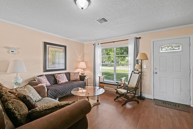 6506 Kings Hwy, Fort Pierce, FL 34951 - living area with a textured ceiling, wood finished floors, ornamental molding, and baseboards