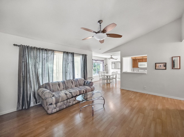 815 W Boynton Beach Blvd Unit 15-203, Boynton Beach, FL 33426 - living area with ceiling fan, lofted ceiling, light wood-type flooring, and baseboards
