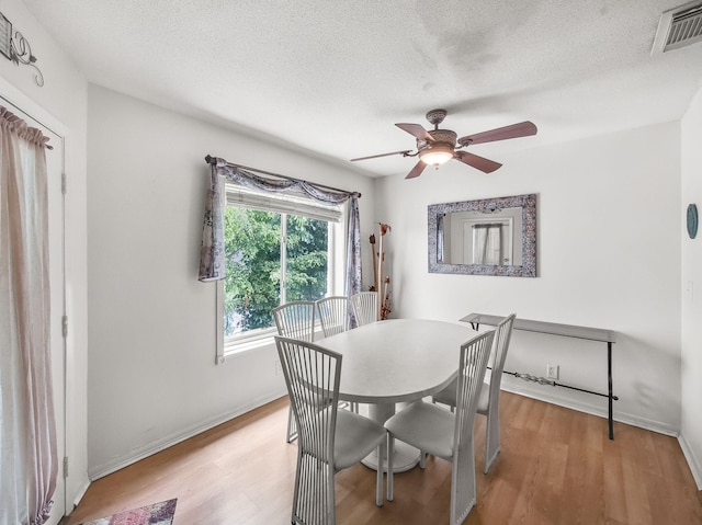 815 W Boynton Beach Blvd Unit 15-203, Boynton Beach, FL 33426 - dining area with ceiling fan, light wood-style flooring, a textured ceiling, and baseboards