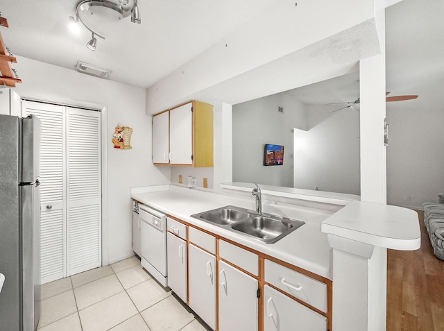 815 W Boynton Beach Blvd Unit 15-203, Boynton Beach, FL 33426 - kitchen featuring freestanding refrigerator, a sink, white dishwasher, ceiling fan, and light countertops
