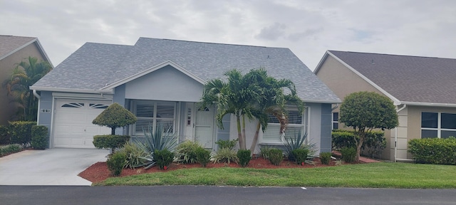 456 NW Marsala Ter, Port Saint Lucie, FL 34986 - view of front of home with an attached garage, driveway, stucco siding, and roof with shingles