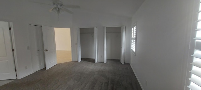 456 NW Marsala Ter, Port Saint Lucie, FL 34986 - unfurnished bedroom with multiple closets, carpet floors, vaulted ceiling, baseboards, and a ceiling fan