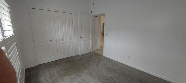 456 NW Marsala Ter, Port Saint Lucie, FL 34986 - unfurnished bedroom featuring carpet flooring, a closet, and baseboards