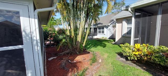 456 NW Marsala Ter, Port Saint Lucie, FL 34986 - view of grassy yard featuring a sunroom