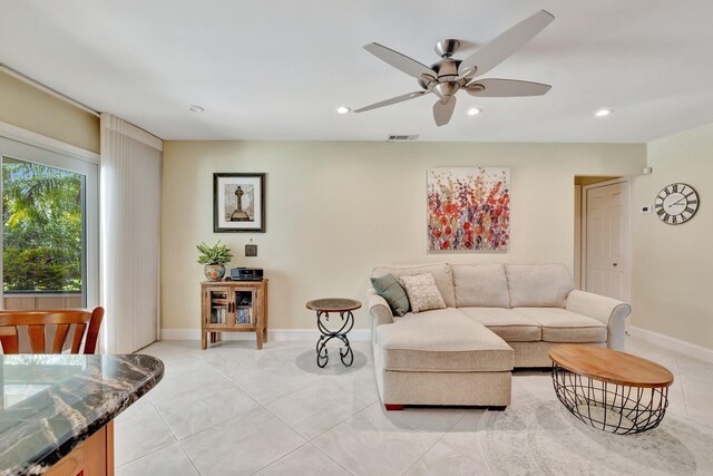 519 SE Brookside Ter, Port Saint Lucie, FL 34983 - living room with a ceiling fan, recessed lighting, baseboards, and light tile patterned floors