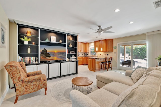 519 SE Brookside Ter, Port Saint Lucie, FL 34983 - living area featuring light tile patterned floors, recessed lighting, a ceiling fan, and baseboards