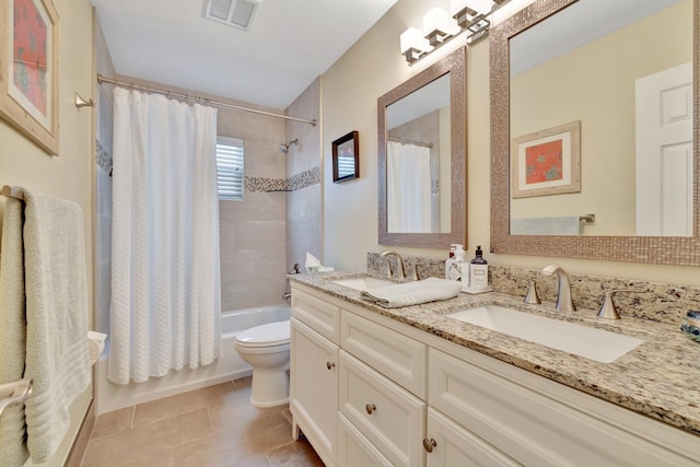 519 SE Brookside Ter, Port Saint Lucie, FL 34983 - bathroom featuring toilet, double vanity, shower / tub combo, and tile patterned flooring