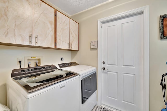 519 SE Brookside Ter, Port Saint Lucie, FL 34983 - laundry area with washing machine and clothes dryer and cabinet space