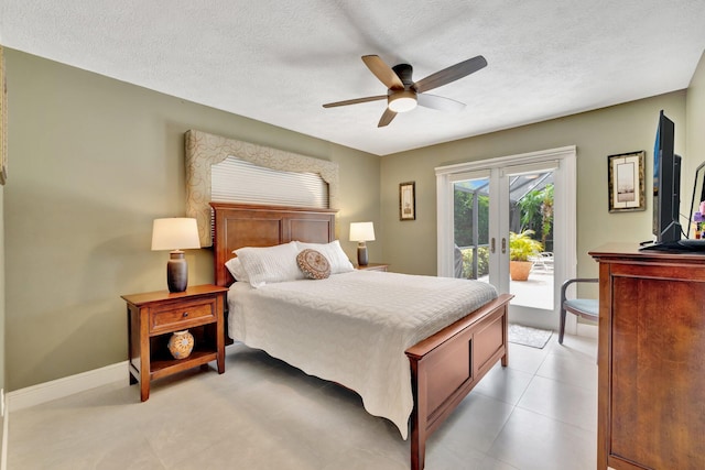 519 SE Brookside Ter, Port Saint Lucie, FL 34983 - bedroom with access to outside, a textured ceiling, ceiling fan, baseboards, and light tile patterned floors