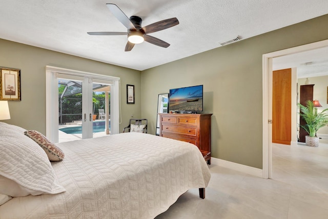 519 SE Brookside Ter, Port Saint Lucie, FL 34983 - bedroom with access to outside, french doors, baseboards, ceiling fan, and a textured ceiling