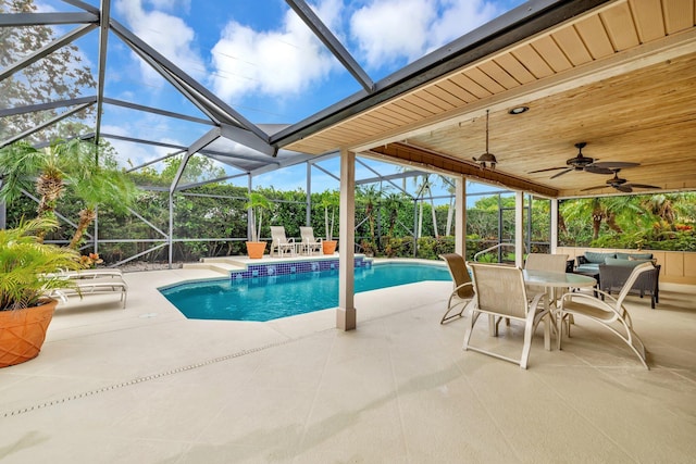 519 SE Brookside Ter, Port Saint Lucie, FL 34983 - swimming pool with a patio area, glass enclosure, and outdoor dining area
